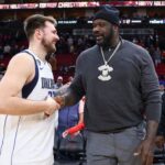 Dallas Mavericks guard Luka Doncic (77) greets Shaquille O'Neal after the game against the Houston Rockets at Toyota Center.