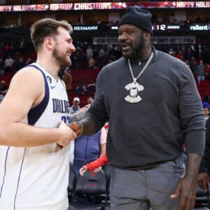 Dallas Mavericks guard Luka Doncic (77) greets Shaquille O'Neal after the game against the Houston Rockets at Toyota Center.