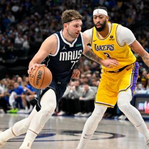 Dallas Mavericks guard Luka Doncic (77) and Los Angeles Lakers forward Anthony Davis (3) in action during the game between the Dallas Mavericks and the Los Angeles Lakers at the American Airlines Center.