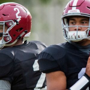 Alabama quarterbacks Jalen Hurts (2) and Tua Tagovailoa (13) warm up as Alabama quarterbacks coach Dan Enos looks on during Alabama's practice on the Barry University campus in Miami Shores, Fla., on Thursday December 27, 2018. Alabama plays Oklahoma in the Orange Bowl on Saturday.