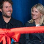 Mathew and Kelly Stafford share a laugh during speeches for the ribbon cutting of the Kelly and Matthew Stafford and Friends Education Center at the S.A.Y Detroit Play Center in Detroit on Monday, April 1, 2024.