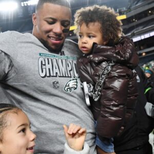 Philadelphia Eagles running back Saquon Barkley (26) celebrates after winning the NFC Championship game against the Washington Commanders at Lincoln Financial Field.