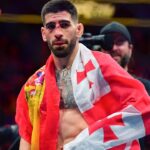 Ilia Topuria celebrates his championship victory against Alexander Volkanovski during UFC 298 at Honda Center.