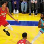 Shaqís OGs guard Kyrie Irving (11) of the Dallas Mavericks controls the ball against Chuckís Global Stars forward Victor Wembanyama (1) of the San Antonio Spurs during the 2025 NBA All Star Game at Chase Center.