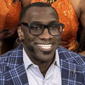 Shannon Sharpe poses with members of the Savannah State Marching Band after a broadcast of \"First Take\" at SSU Monday
