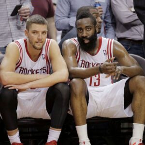 Houston Rockets small forward Chandler Parsons (25) and shooting guard James Harden (13) sit on the bench during the fourth quarter against the Portland Trail Blazers at Toyota Center.