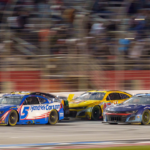 Kyle Larson (5) fights for position during the final laps at Atlanta Motor Speedway.