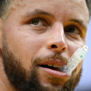 Golden State Warriors guard Stephen Curry (30) chews his mouthguard against the Indiana Pacers in the fourth quarter at Chase Center.