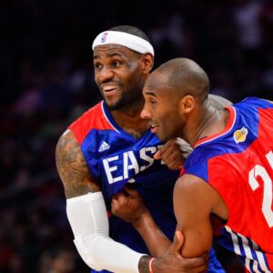 Western Conference guard Kobe Bryant (24) of the Los Angeles Lakers grabs onto Eastern Conference forward LeBron James (6) of the Miami Heat in the fourth quarter of the 2013 NBA all star game at the Toyota Center.