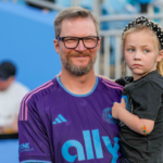 Dale Earnhardt Jr. with his daughter Isla Rose during pregame warm ups between the Charlotte FC and the Colorado Rapids at Bank of America Stadium.