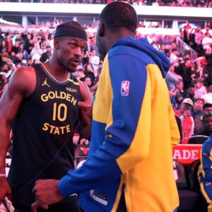 Golden State Warriors forward Jimmy Butler (10) talks with new teammate Draymond Green before taking on the Chicago Bulls at the United Center