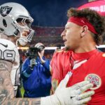 Kansas City Chiefs quarterback Patrick Mahomes (15) greets Las Vegas Raiders defensive end Maxx Crosby (98) after the game at GEHA Field at Arrowhead Stadium.