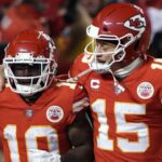 Jan 23, 2022; Kansas City, Missouri, USA; Kansas City Chiefs wide receiver Tyreek Hill (10) celebrates his touchdown with quarterback Patrick Mahomes (15) against the Buffalo Bills during the second half of the AFC Divisional playoff football game at GEHA Field at Arrowhead Stadium.