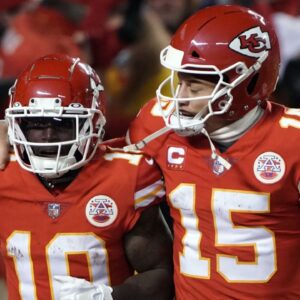 Jan 23, 2022; Kansas City, Missouri, USA; Kansas City Chiefs wide receiver Tyreek Hill (10) celebrates his touchdown with quarterback Patrick Mahomes (15) against the Buffalo Bills during the second half of the AFC Divisional playoff football game at GEHA Field at Arrowhead Stadium.