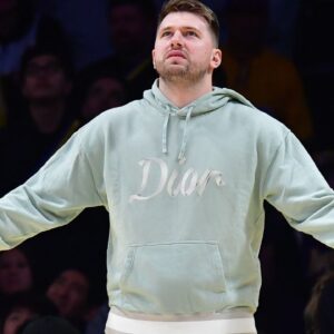 Los Angeles Lakers guard Luka Doncic (77) reacts watching game action against the Indiana Pacers during the second half at Crypto.com Arena.