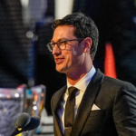 NASCAR Cup Series driver Joey Logano (22) talks to the audience after being announced as the three time Cup champion during the NASCAR Awards Banquet at Charlotte Convention Center.
