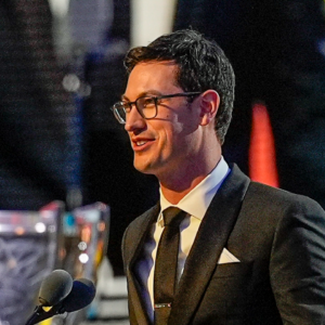 NASCAR Cup Series driver Joey Logano (22) talks to the audience after being announced as the three time Cup champion during the NASCAR Awards Banquet at Charlotte Convention Center.