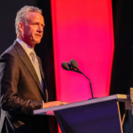 Nov 22, 2024; Charlotte, NC, USA; NASCAR President Steve Phelps speaks during the NASCAR Awards Banquet at Charlotte Convention Center. Mandatory Credit: Jim Dedmon-Imagn Images