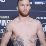 Justin Gaethje steps on the scale for the official weigh-ins at Hilton Midtown for UFC268 - Usman vs Covington 2