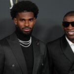 Deion Sanders (right) with his son Shedeur Sanders on the red carpet before Super Bowl LIX NFL Honors at Saenger Theatre.