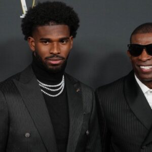 Deion Sanders (right) with his son Shedeur Sanders on the red carpet before Super Bowl LIX NFL Honors at Saenger Theatre.