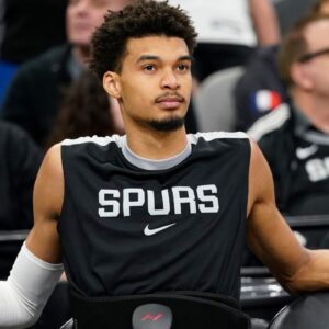 San Antonio Spurs center Victor Wembanyama (1) rests before a game against the Milwaukee Bucks at Frost Bank Center.