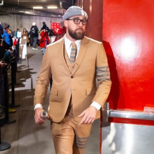 Kansas City Chiefs tight end Travis Kelce (87) arrives prior to the game against the Buffalo Bills in the AFC Championship game at GEHA Field at Arrowhead Stadium.