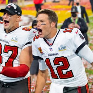Tampa Bay Buccaneers quarterback Tom Brady (12) and tight end Rob Gronkowski (87) celebrate after beating the Kansas City Chiefs in Super Bowl LV at Raymond James Stadium.