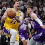 Los Angeles Lakers guard Luka Doncic (77) is fouled by Utah Jazz forward Kyle Filipowski (22) during the second quarter at Delta Center.