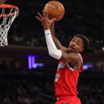 Memphis Grizzlies guard Ja Morant (12) rebounds during the second half against the New York Knicks at Madison Square Garden.