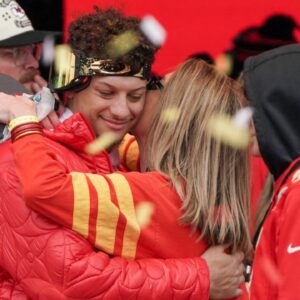 Kansas City Chiefs quarterback Patrick Mahomes (15) embraces his mother Randi Martin during the Kansas City Chiefs Super Bowl parade.