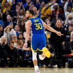 Golden State Warriors guard Stephen Curry (30) reacts after hitting a three-point shot against the Dallas Mavericks during the third quarter at Chase Center.