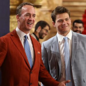 Former NFL quarterback Peyton Manning interviews NFL prospect Drake Maye, a quarterback who played at North Carolina, as he walks the red carpet for NFL draft day at the Fox Theatre in Detroit on Thursday, April 25, 2024.