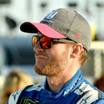 NASCAR Cup Series driver Dale Earnhardt Jr. (88) waits by his car during qualifying for the Hollywood Casino 400 at Kansas Speedway.