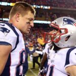 New England Patriots wide receiver Julian Edelman (11) celebrates with tight end Rob Gronkowski (87) after defeating the Kansas City Chiefs in overtime of the AFC Championship game at Arrowhead Stadium.