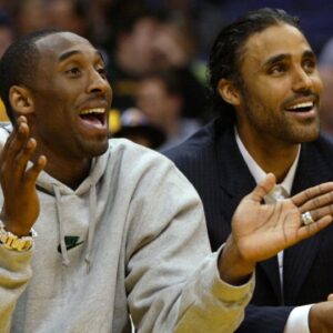 Injured Lakers' Kobe Bryant (left) and Rick Fox watch teammates during second half action of Los Angeles' 97 - 71 win over Denver at Staples Center.