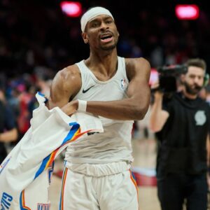 Oklahoma City Thunder guard Shai Gilgeous-Alexander (2) gives his shirt away to a fan after a game against the Portland Trail Blazers at Moda Center.
