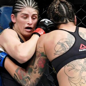 Julia Avila (red gloves) fights against Pannie Kianzad (blue gloves) at T-Mobile Arena.