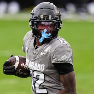 Nov 16, 2024; Boulder, Colorado, USA; Colorado Buffaloes wide receiver Travis Hunter (12) carries the ball for a touchdown in the fourth quarter against the Utah Utes at Folsom Field.