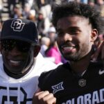Nov 29, 2024; Boulder, Colorado, USA; Colorado Buffaloes safety Shilo Sanders (21) and head coach Deion Sanders and quarterback Shedeur Sanders (2) and social media producer Deion Sanders Jr. following the win against the Oklahoma State Cowboys at Folsom Field.