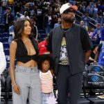 Former basketball player Dwyane Wade attends with his wife Gabrielle Union a WNBA game between the Chicago Sky and Connecticut Sun at Wintrust Arena.