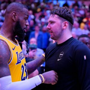 Los Angeles Lakers forward LeBron James (23) talks with Dallas Mavericks guard Luka Doncic (77) after the Mavericks defeat the Lakes at the American Airlines Center