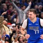 Dallas Mavericks guard Luka Doncic (77) celebrates after making a basket against the Minnesota Timberwolves during the first quarter at the American Airlines Center.