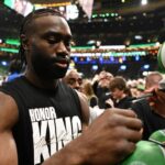 Boston Celtics guard Jaylen Brown (7) signs autographs before a game against the San Antonio Spurs at the TD Garden.