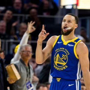 Golden State Warriors guard Stephen Curry (30) reacts after hitting a three-point shot against the Portland Trail Blazers during the third quarter at Chase Center.