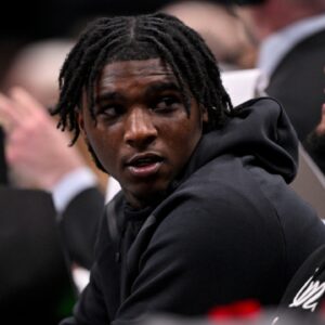 Feb 12, 2025; Dallas, Texas, USA; Miami Hurricanes Quarterback Cam Ward watches the game between the Dallas Mavericks and the Golden State Warriors during the second half at the American Airlines Center.