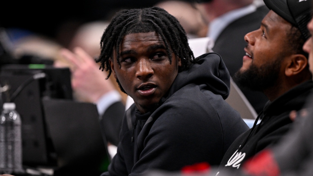 Feb 12, 2025; Dallas, Texas, USA; Miami Hurricanes Quarterback Cam Ward watches the game between the Dallas Mavericks and the Golden State Warriors during the second half at the American Airlines Center.