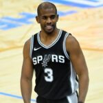 Mar 27, 2025; Cleveland, Ohio, USA; San Antonio Spurs guard Chris Paul (3) reacts after a play in the fourth quarter against the Cleveland Cavaliers at Rocket Arena. Mandatory Credit: David Richard-Imagn Images