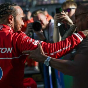 Lewis Hamilton of Great Britain and Scuderia Ferrari celebrates his pole with his father Anthony Hamilton during Sprint Qualifying ahead of the F1 Grand Prix of China