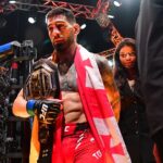 Ilia Topuria celebrates his championship victory against Alexander Volkanovski during UFC 298 at Honda Center.